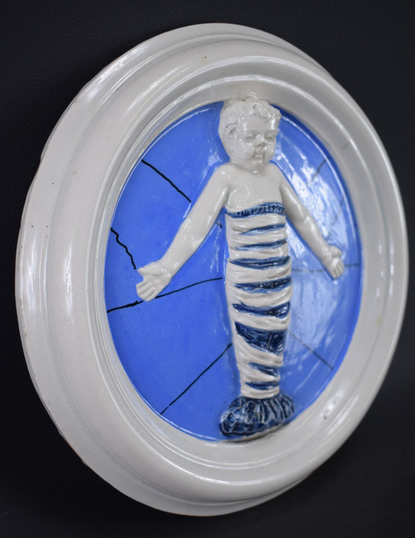 Médaillon Jésus emmailloté d'après Della Robbia